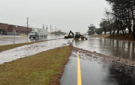 Photo Caption: Localized flooding on the westbound lanes of Forest Parkway.