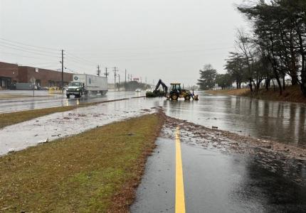 Photo Caption: Localized flooding on the westbound lanes of Forest Parkway.