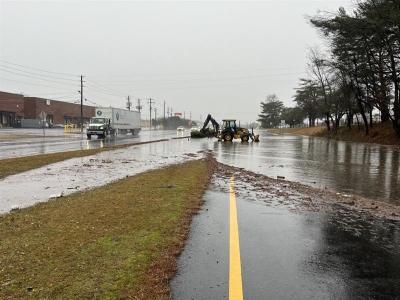 Photo Caption: Localized flooding on the westbound lanes of Forest Parkway.